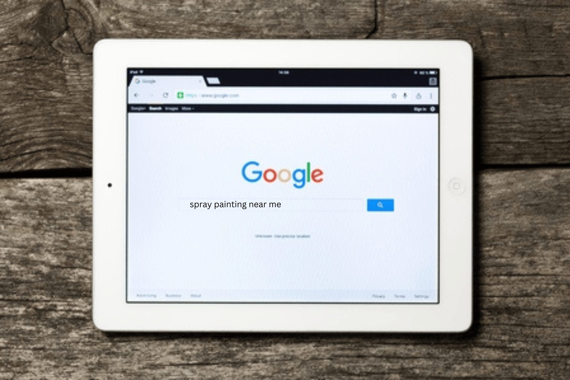 A spray painting near me search performed on Google on a white iPad